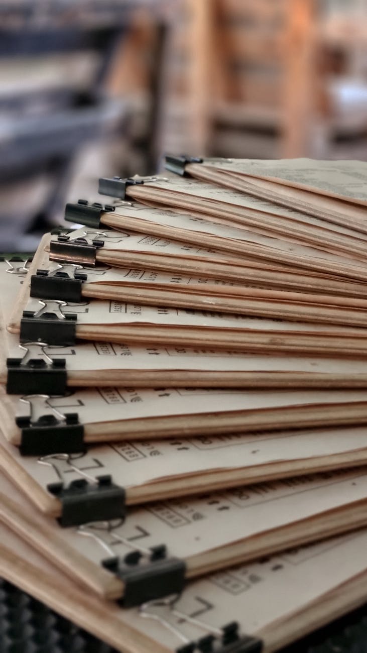 pile of documents with binder clips